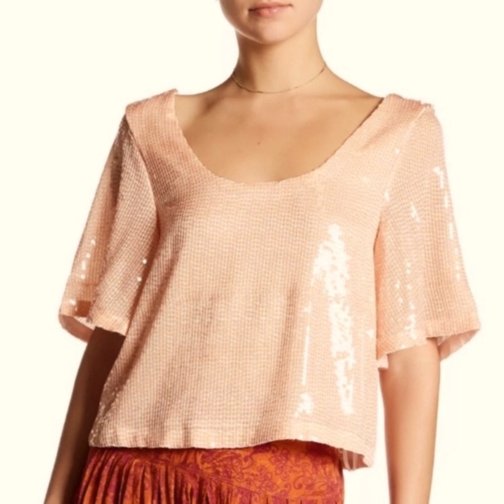 Free people night Fever Sequin Top in peach color.